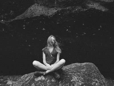 Person breathing deeply during meditation session